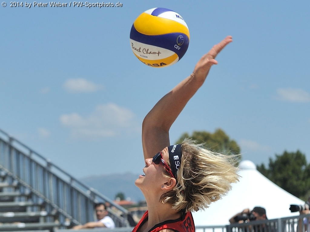 Laura Ludwig of Germany dives for the ball during a Women 